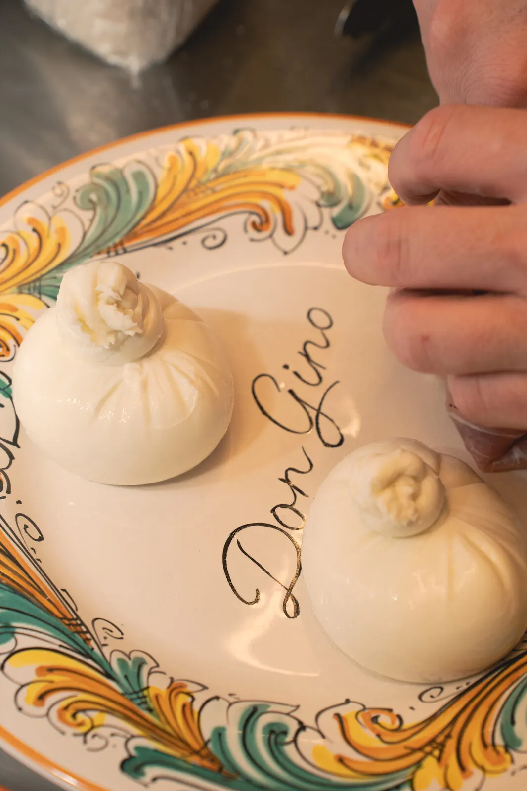 Burrata served on a painted Don Gino plate